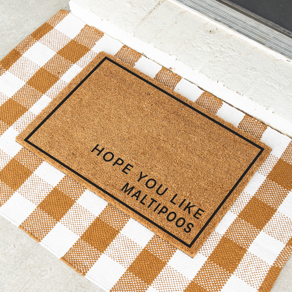 Hope You Like Maltipoos minimalist coir doormat with a thin black border on a tan and white check rug