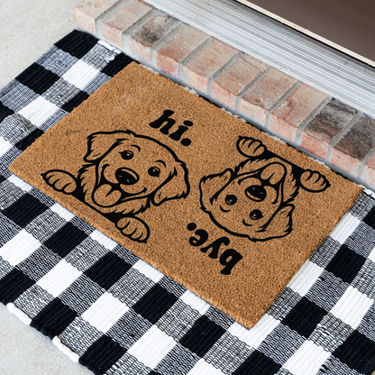 Hi Bye dog coir doormat at an angle on a black and white buffalo check rug