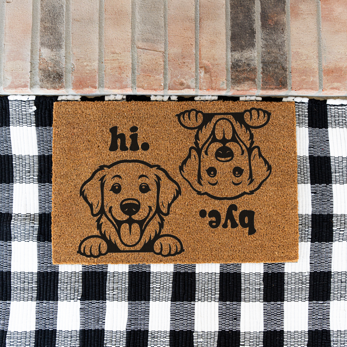 Hi Bye dog coir doormat on a black and white buffalo check rug at a brick step