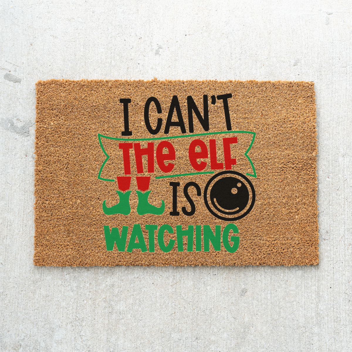 I Can't The Elf Is Watching coir doormat on light gray concrete