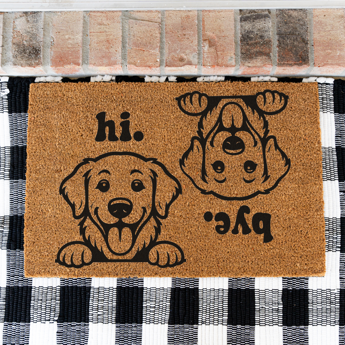 Hi Bye dog coir doormat on a black and white buffalo check rug, close view