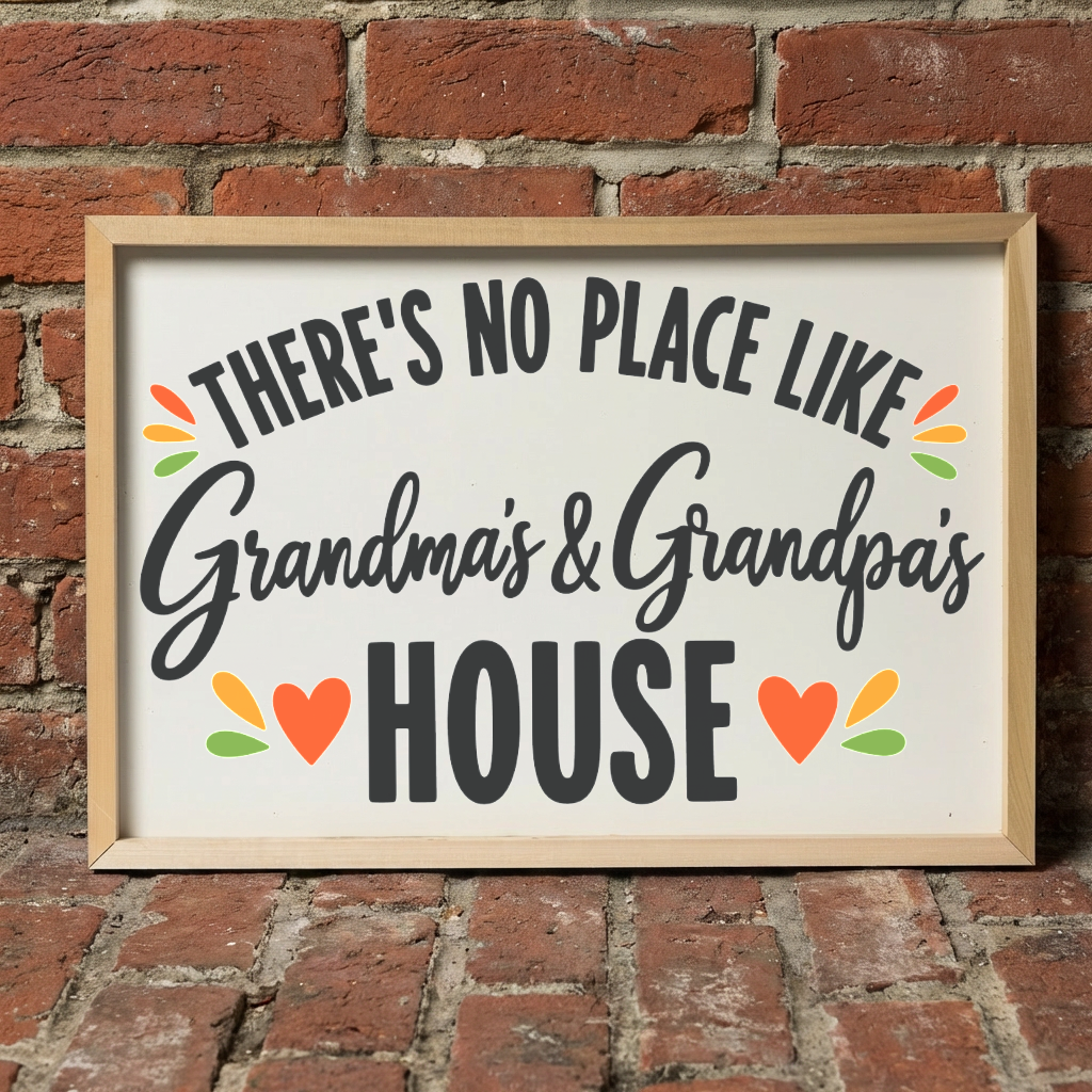 There's No Place Like Grandma's & Grandpa's House framed sign with a natural wood frame leaning on a red brick wall