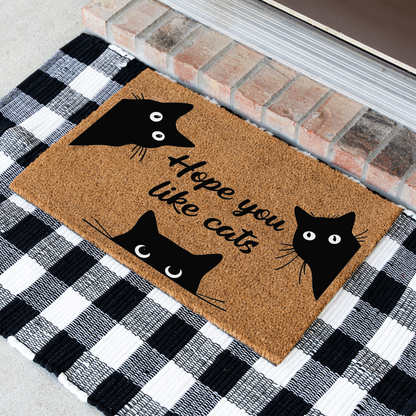 Hope You Like Cats coir doormat with three peeking black cats at an angle on a black and white buffalo check rug