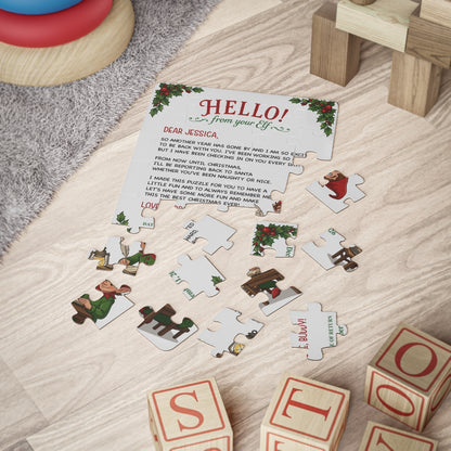Personalized elf letter jigsaw puzzle partly assembled on a floor beside wooden toy blocks