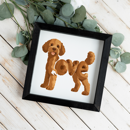 Standing red doodle love square framed sign with a black frame on white wood planks with eucalyptus