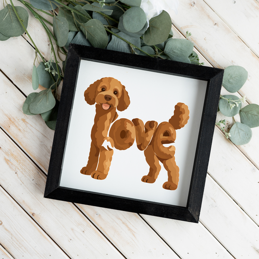 Standing red doodle love square framed sign with a black frame on white wood planks with eucalyptus