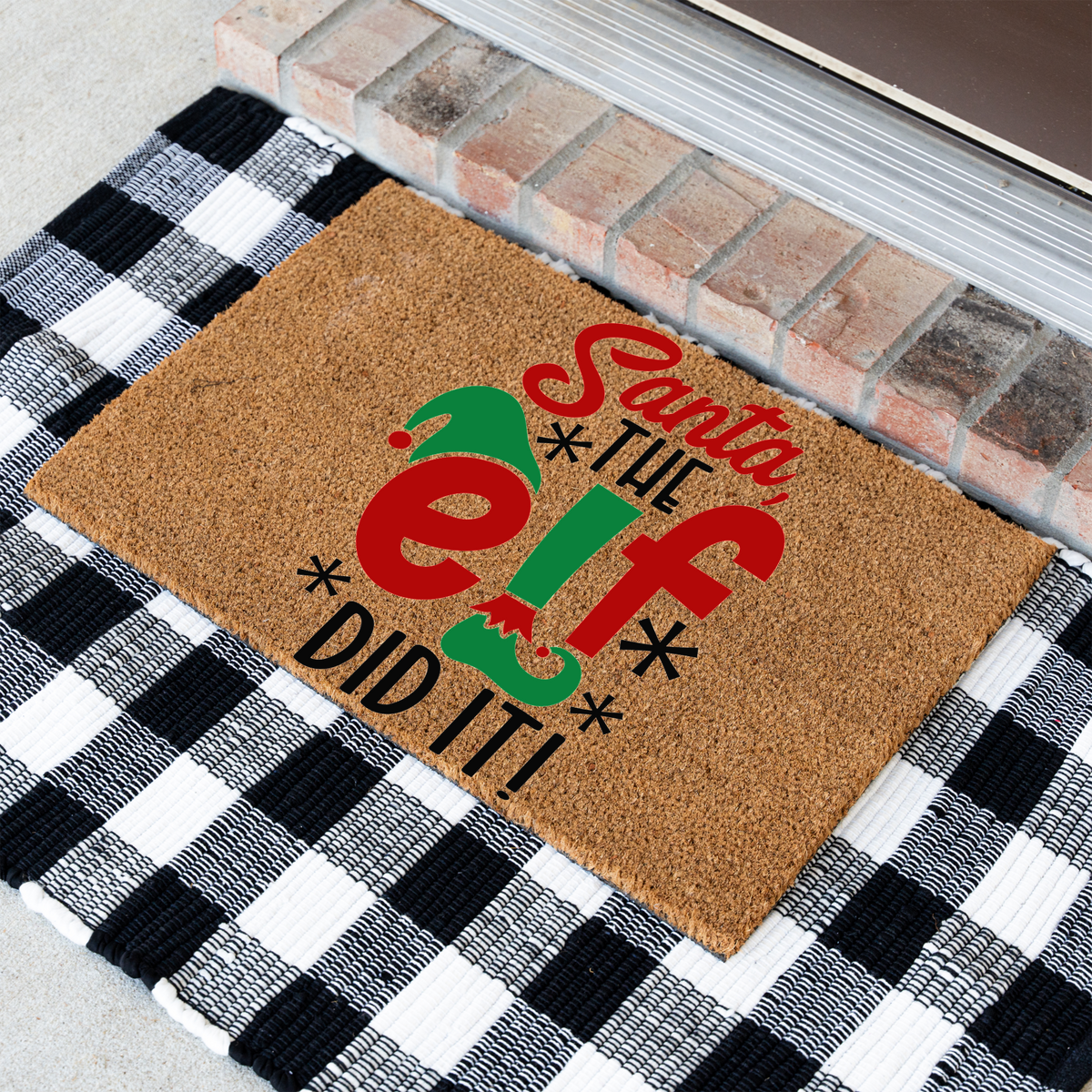 Santa The Elf Did It coir doormat at an angle on a black and white buffalo check rug