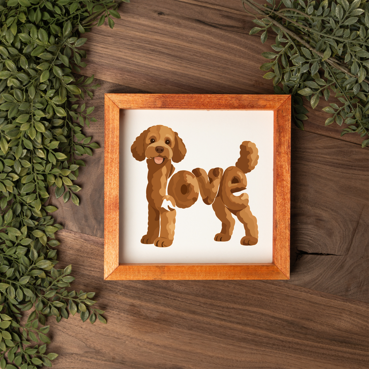 Standing red doodle love square framed sign with a stained wood frame on a dark wood table with greenery