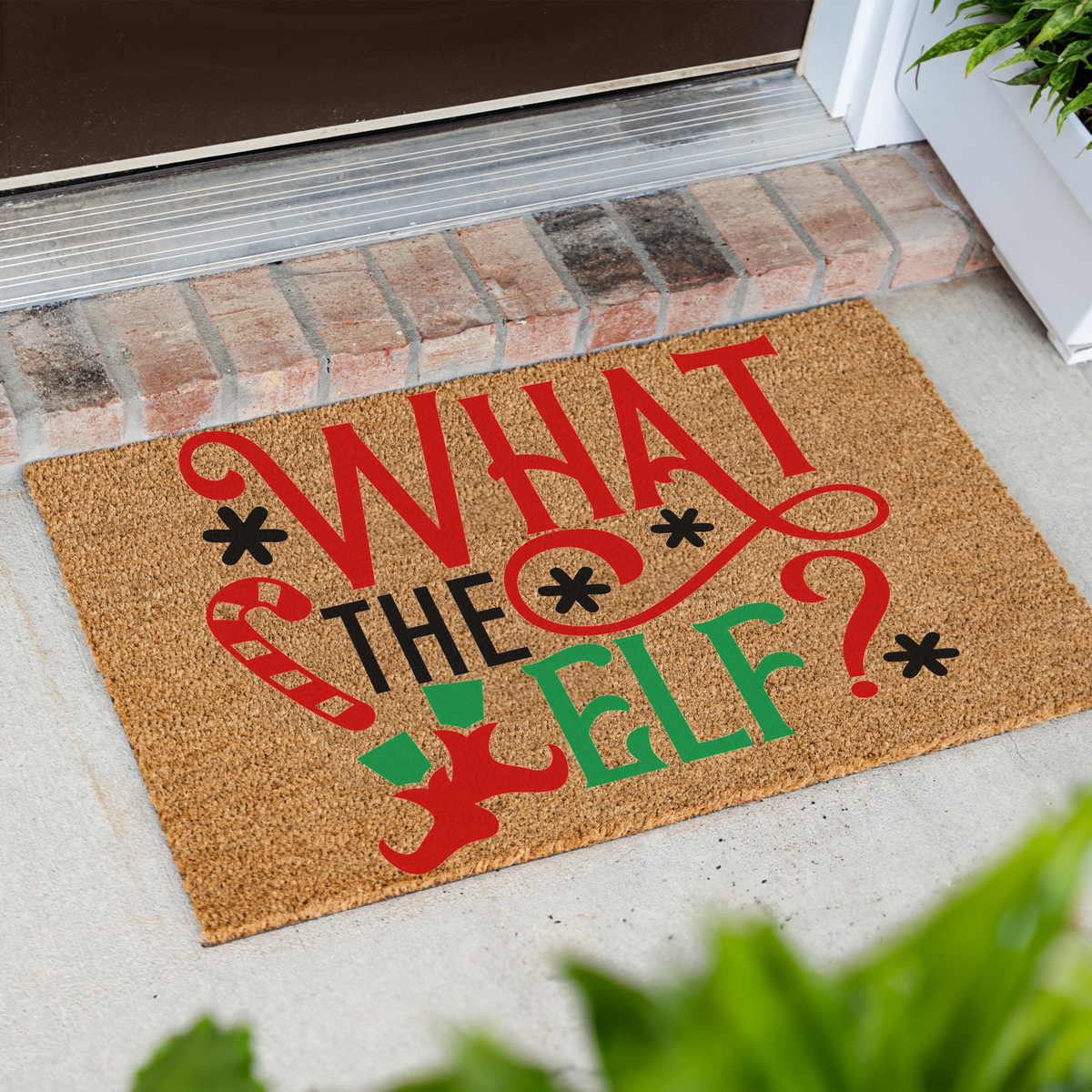 What The Elf coir doormat at an angle in front of a brick step