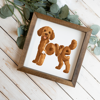 Standing red doodle love square framed sign with a walnut frame on white wood planks with eucalyptus