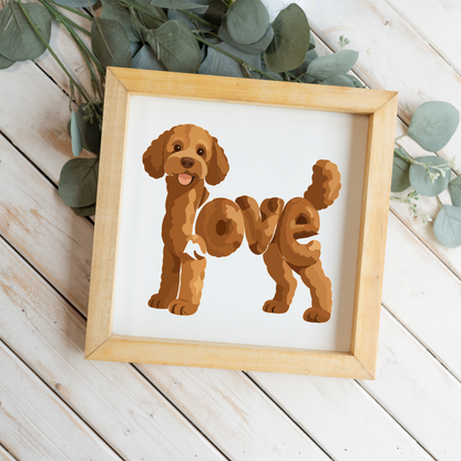 Standing red doodle love square framed sign with a natural wood frame on white wood planks with eucalyptus
