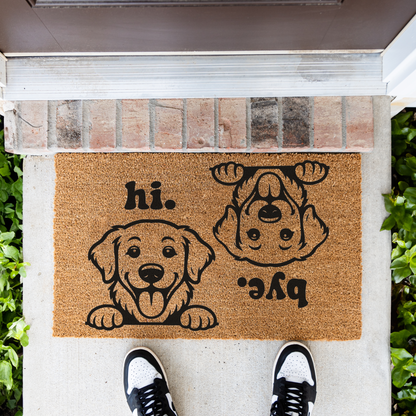 Hi Bye dog coir doormat on a front porch, top-down view