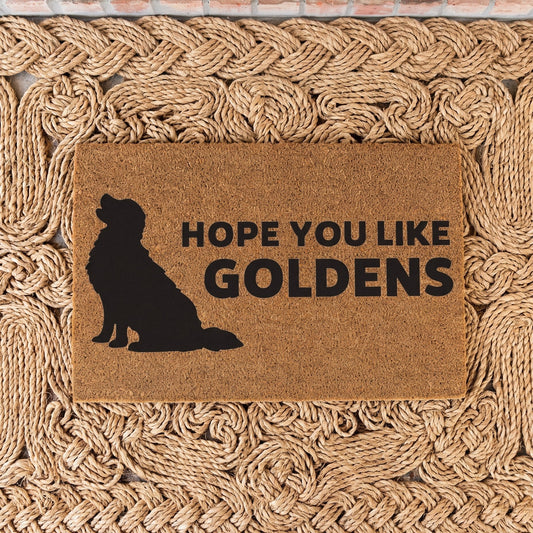 Hope You Like Goldens coir door mat with a golden retriever silhouette on a braided jute rug