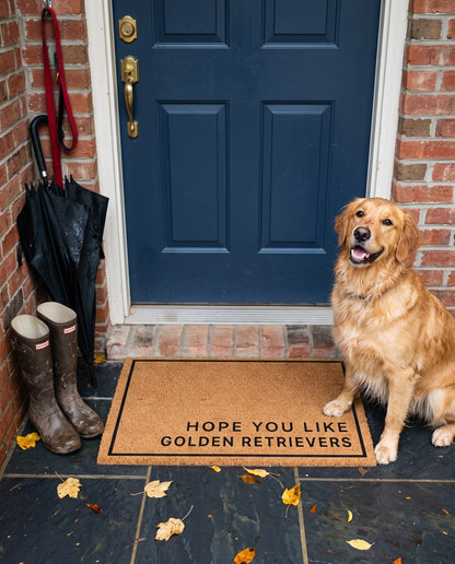 Hope You Like Golden Retrievers minimalist coir doormat at a navy front door with a golden retriever on a rainy day