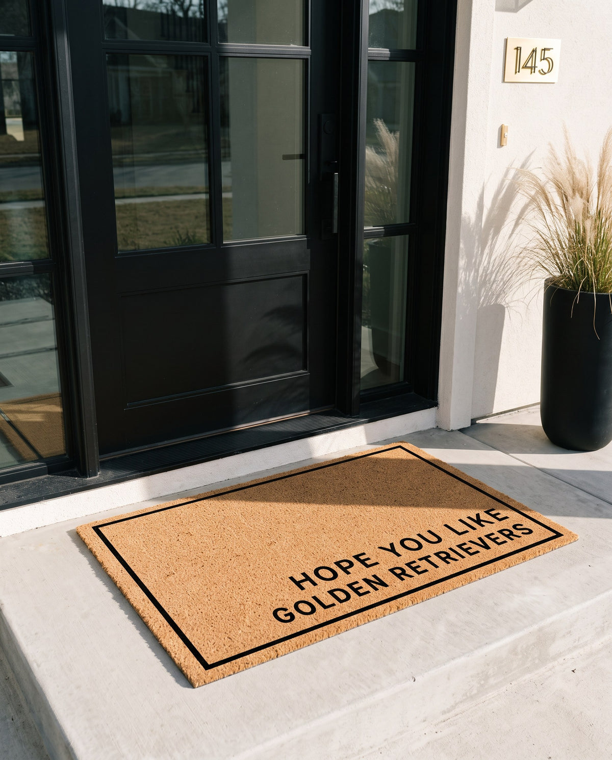Hope You Like Golden Retrievers minimalist coir doormat at a modern black front door