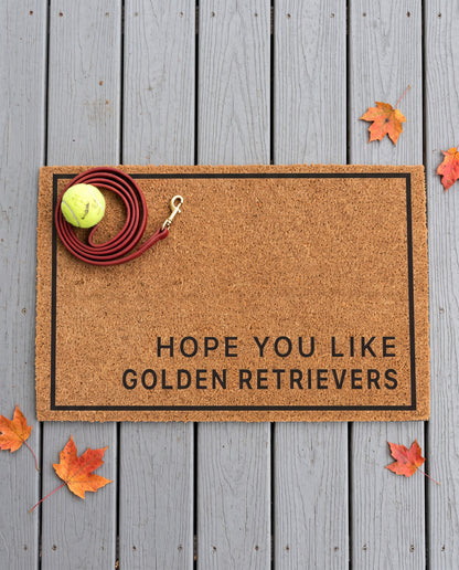 Hope You Like Golden Retrievers minimalist coir doormat with a tennis ball and dog leash on it